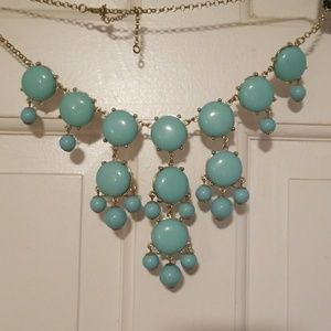 Turquoise colored bubble statement necklace.  Adj